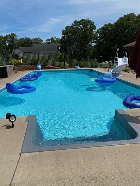 view of swimming pool featuring a water slide