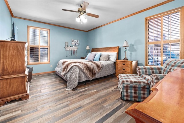 bedroom featuring ceiling fan, dark hardwood / wood-style floors, and ornamental molding