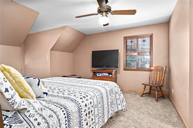 carpeted bedroom with vaulted ceiling and ceiling fan