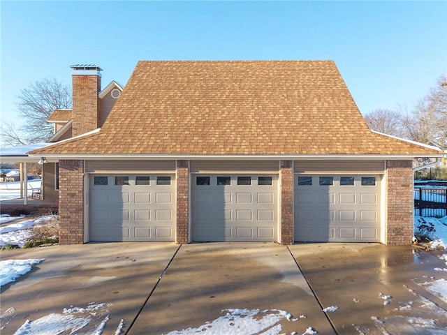 view of snow covered garage