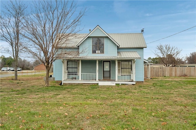 view of front of home with a porch and a front yard