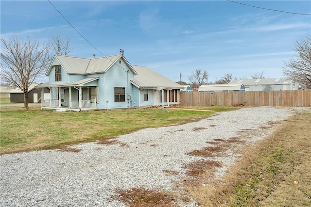 view of side of home featuring a lawn