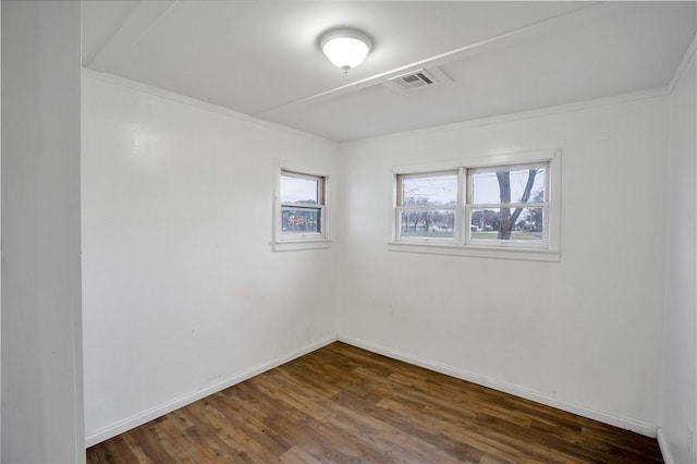 spare room with dark hardwood / wood-style floors