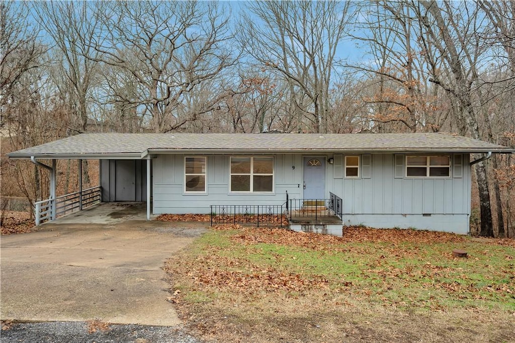 view of front of property with a carport