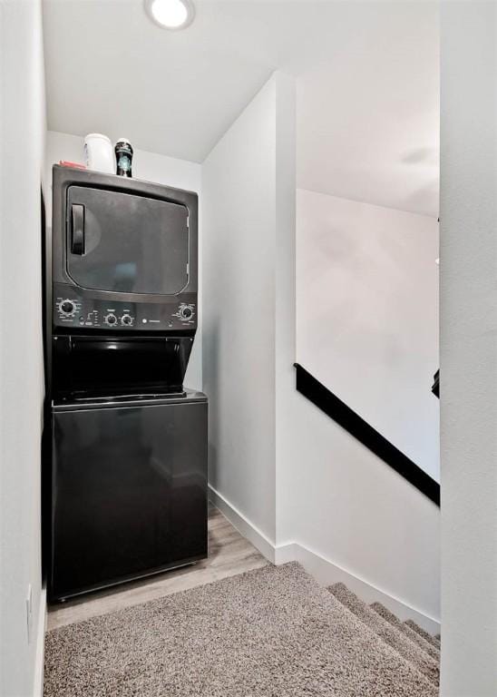 kitchen with stacked washer / dryer