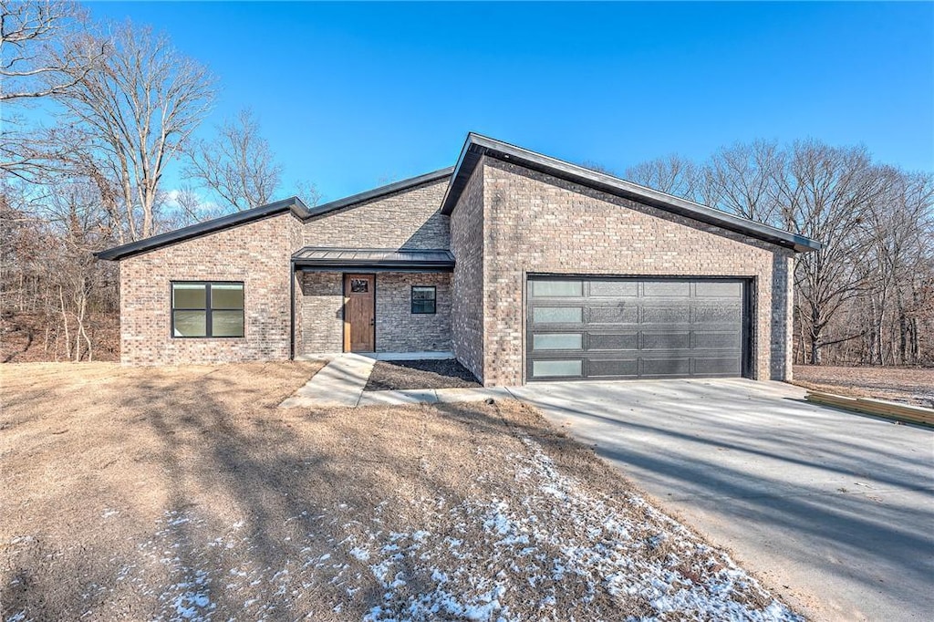 view of front of property featuring a garage