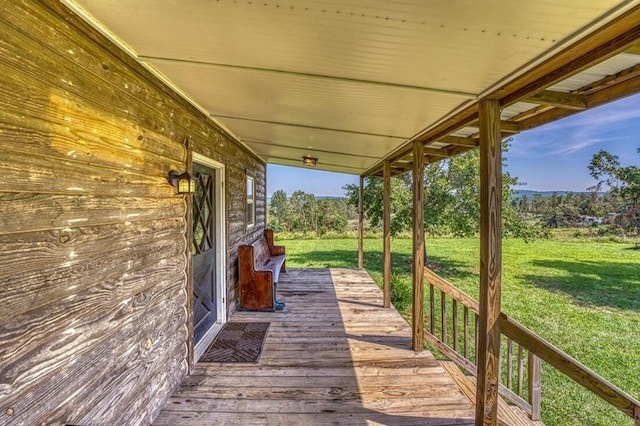 deck featuring a lawn