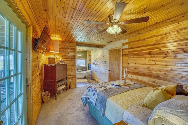 carpeted bedroom featuring wood ceiling and wood walls