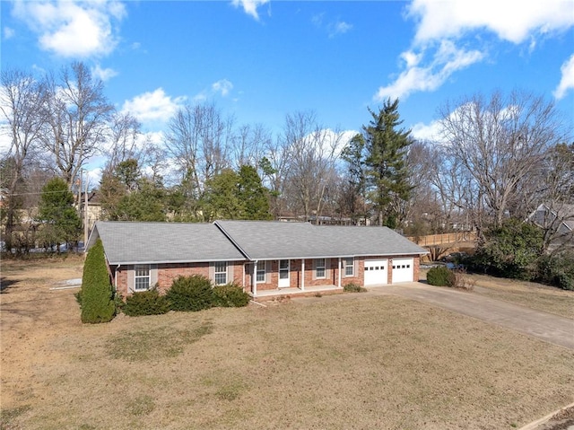 ranch-style home with a front lawn and a garage