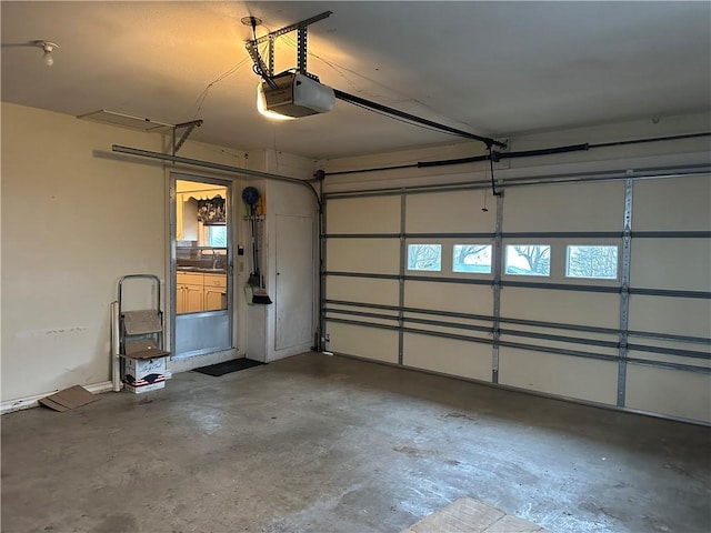 garage featuring a garage door opener