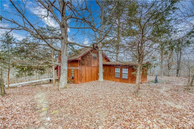 view of side of property with an outbuilding