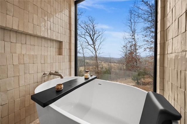 bathroom featuring a tub to relax in