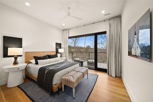 bedroom featuring access to exterior, light hardwood / wood-style flooring, and ceiling fan