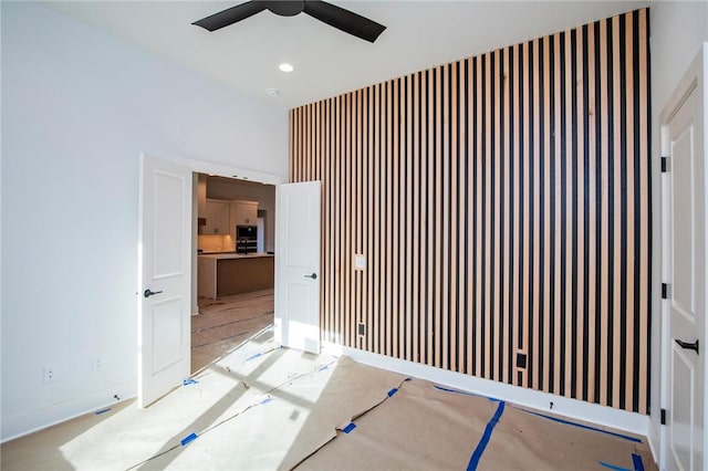 empty room with a ceiling fan and recessed lighting