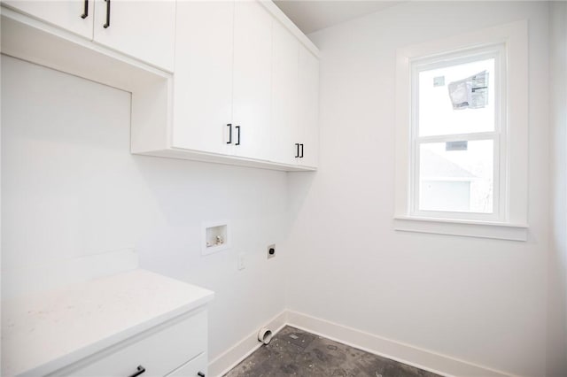 laundry room featuring washer hookup, hookup for an electric dryer, cabinet space, and baseboards