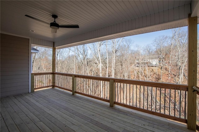 wooden terrace featuring a ceiling fan