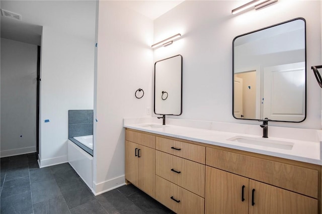 20 Singleton Dr, Bella Vista, AR 72715 - full bathroom with double vanity, baseboards, and a garden tub