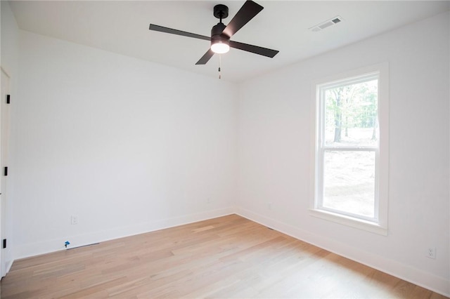 20 Singleton Dr, Bella Vista, AR 72715 - empty room featuring light wood-style floors, a ceiling fan, and baseboards