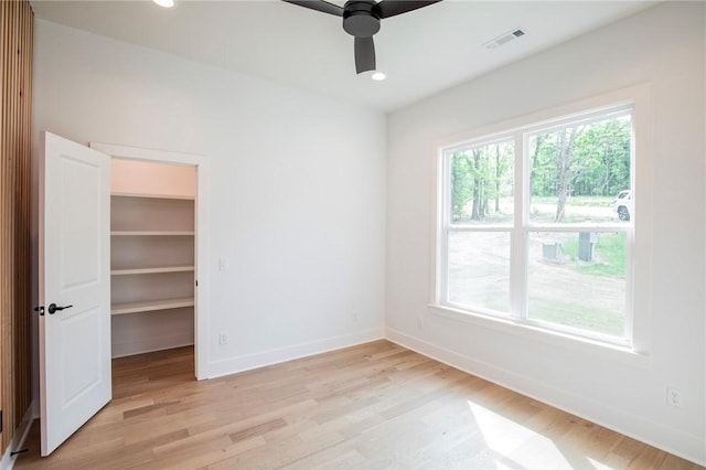 20 Singleton Dr, Bella Vista, AR 72715 - unfurnished room featuring light wood finished floors, healthy amount of natural light, baseboards, and recessed lighting