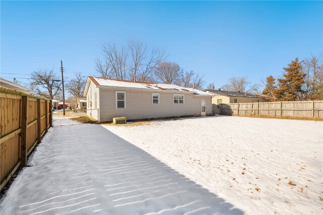 back of property featuring central AC