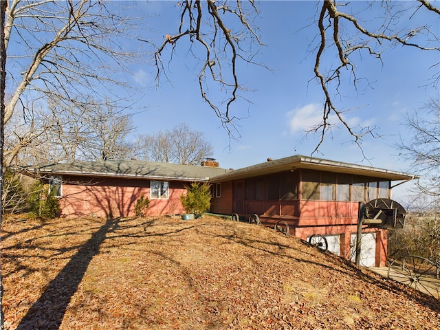 view of front of home with a sunroom