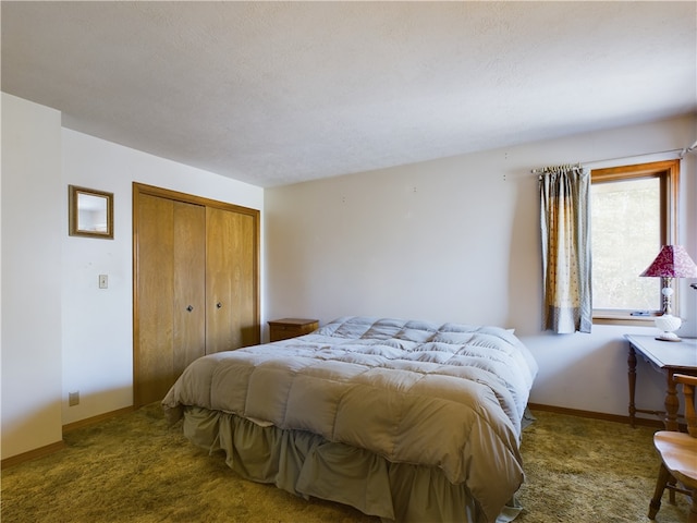 bedroom with a closet and dark carpet