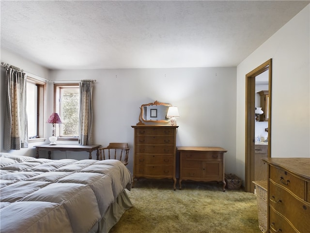 carpeted bedroom with a textured ceiling