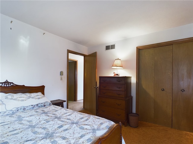 bedroom with carpet floors and a closet