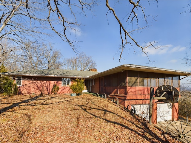 exterior space featuring a sunroom