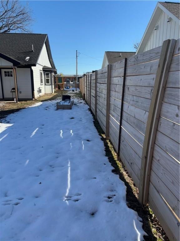 view of yard covered in snow