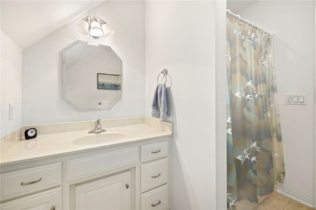 bathroom featuring tile patterned floors, a shower with curtain, vanity, and lofted ceiling