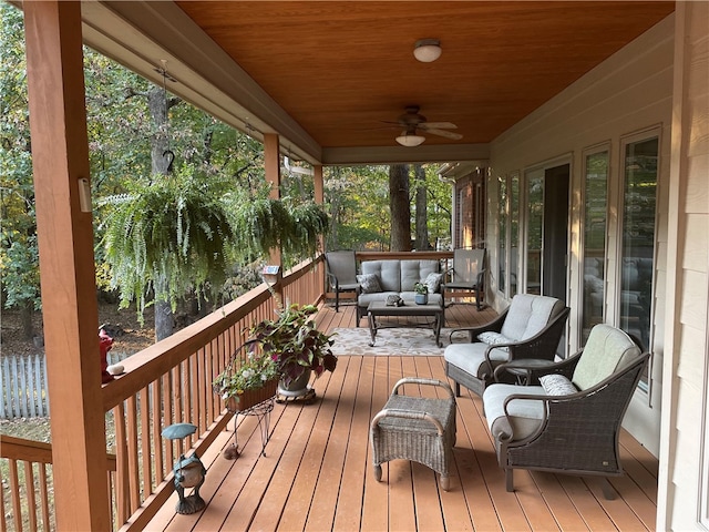 deck featuring outdoor lounge area and ceiling fan