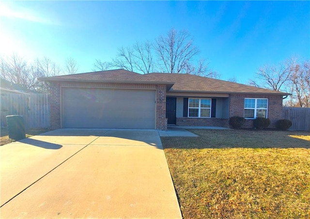 single story home featuring a front lawn and a garage