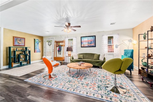 living room with ceiling fan and hardwood / wood-style floors