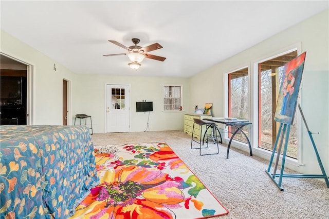 bedroom featuring ceiling fan and light colored carpet