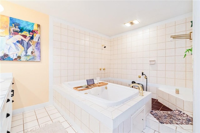 bathroom featuring tile patterned flooring, vanity, tile walls, and tiled tub