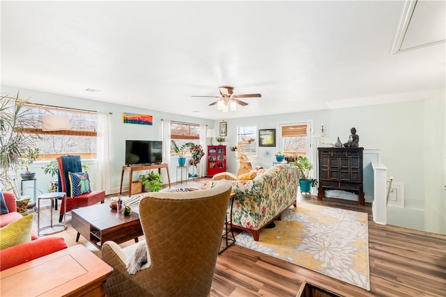 living room with hardwood / wood-style flooring and ceiling fan