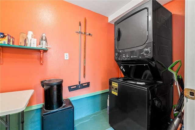 laundry room featuring stacked washing maching and dryer