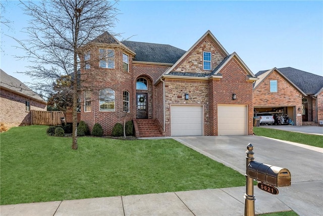 view of front of home featuring a garage and a front yard