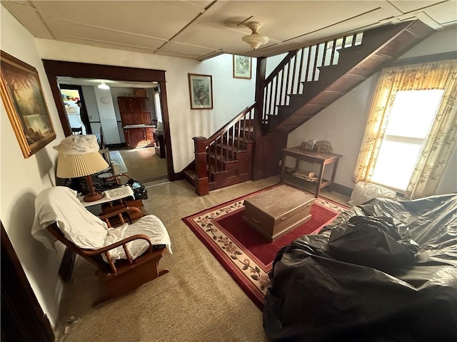 living room featuring a drop ceiling