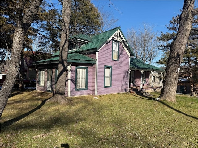 view of property exterior with a lawn