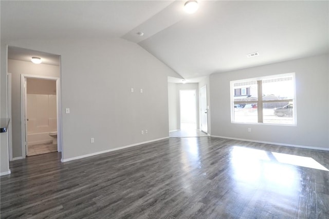 unfurnished living room with dark wood-type flooring and lofted ceiling