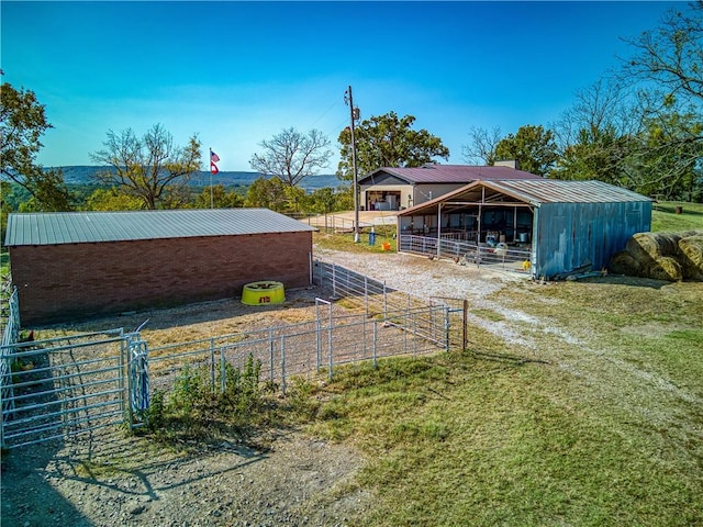 view of yard featuring an exterior structure and an outdoor structure