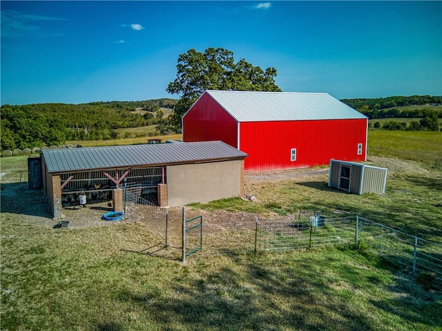 view of horse barn with a rural view