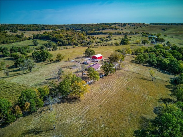 birds eye view of property with a rural view