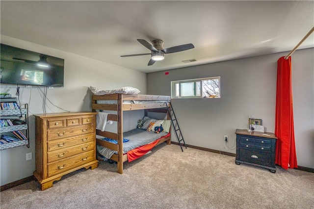 bedroom featuring a ceiling fan, light colored carpet, visible vents, and baseboards