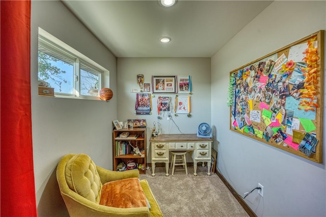 living area with carpet flooring and baseboards