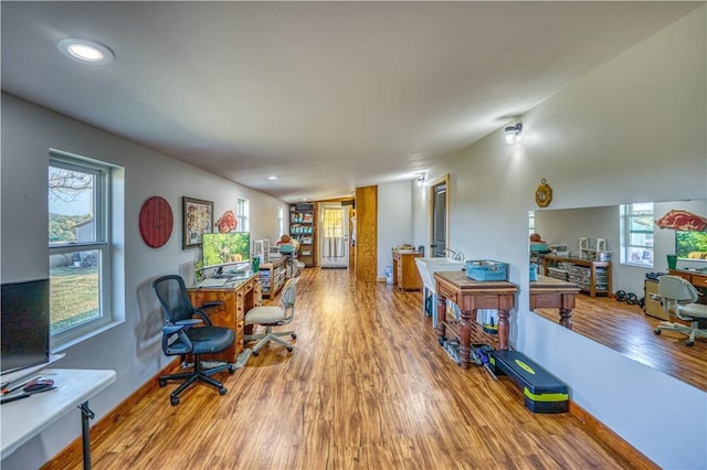 interior space with recessed lighting, wood finished floors, and baseboards