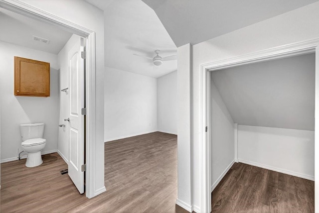 interior space featuring visible vents, a ceiling fan, and wood finished floors