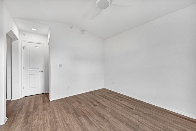 unfurnished room with ceiling fan, baseboards, lofted ceiling, and wood finished floors